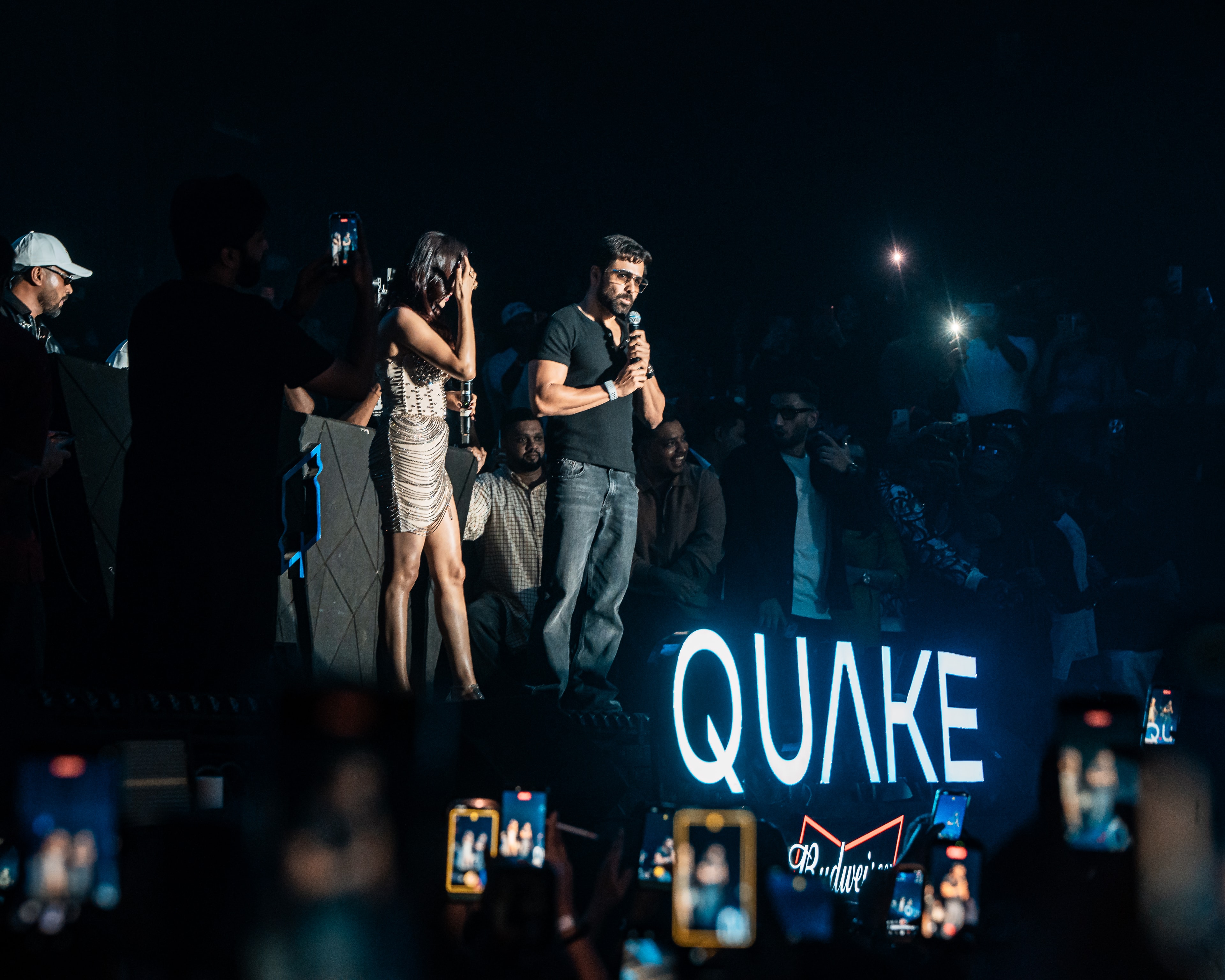 Emraan Hashmi on stage at Quake, phones raised in the crowd